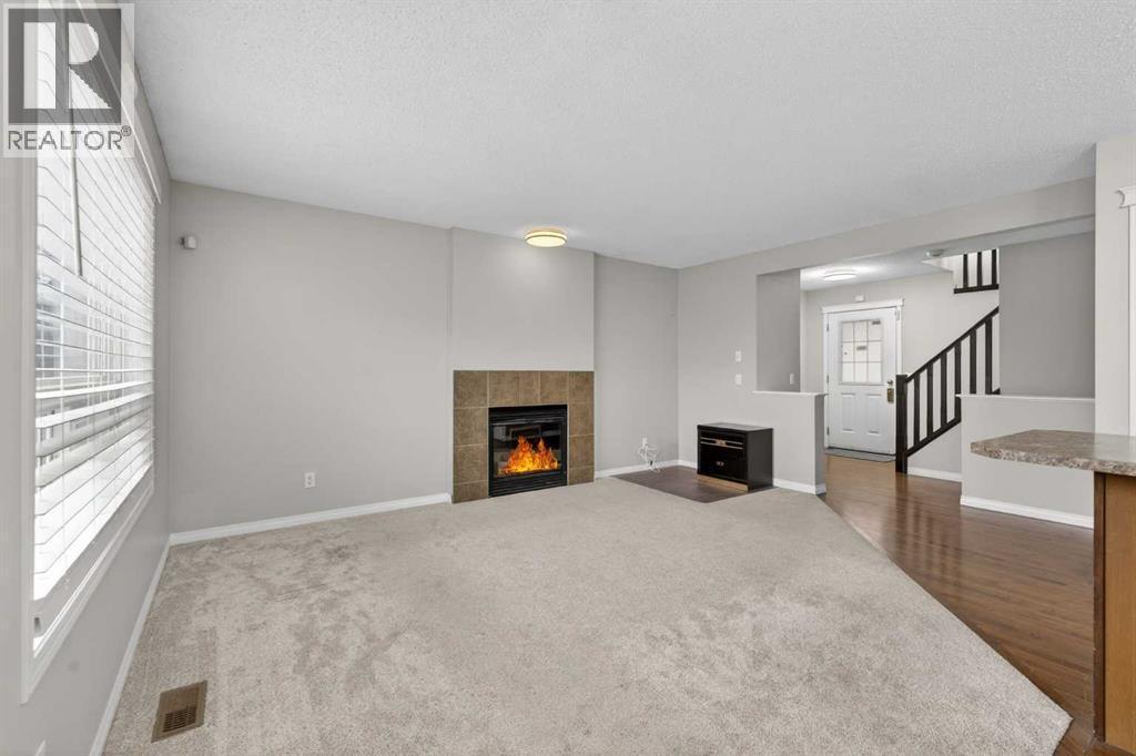 23 Taralake Lane Ne, Calgary, AB - Indoor With Fireplace