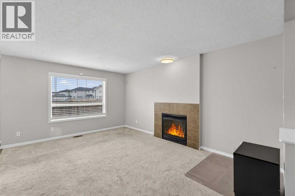 23 Taralake Lane Ne, Calgary, AB - Indoor Photo Showing Living Room With Fireplace