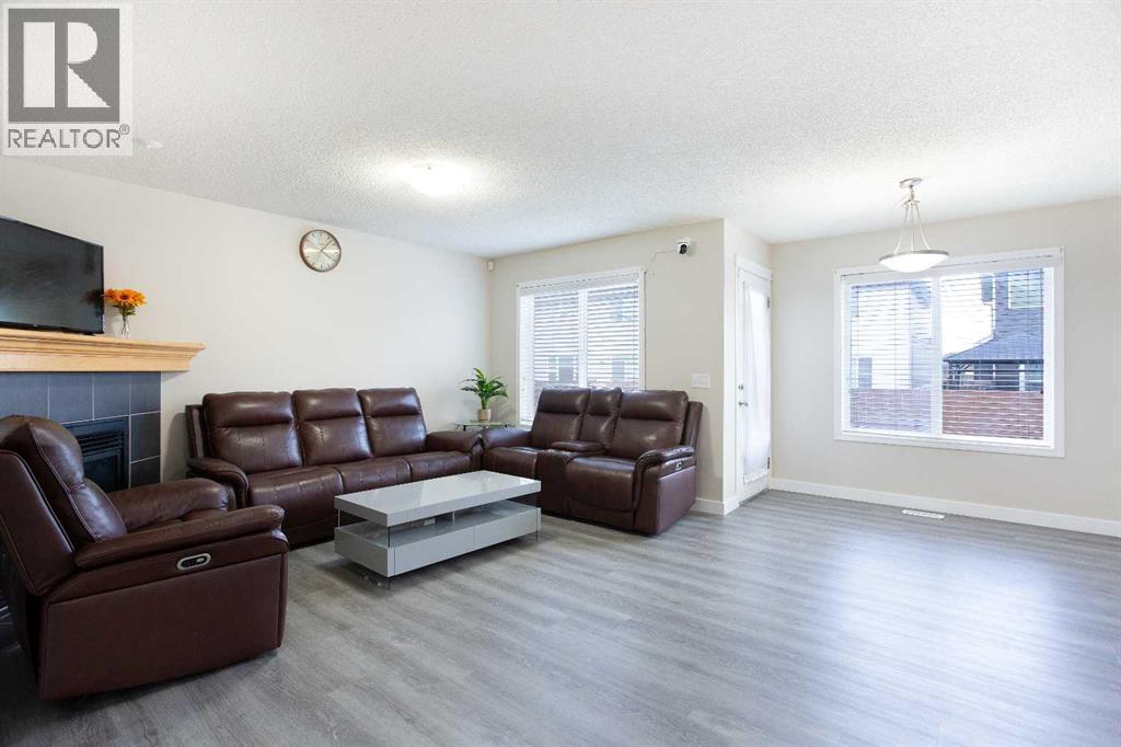 138 Saddlecrest Way Ne, Calgary, AB - Indoor Photo Showing Living Room With Fireplace