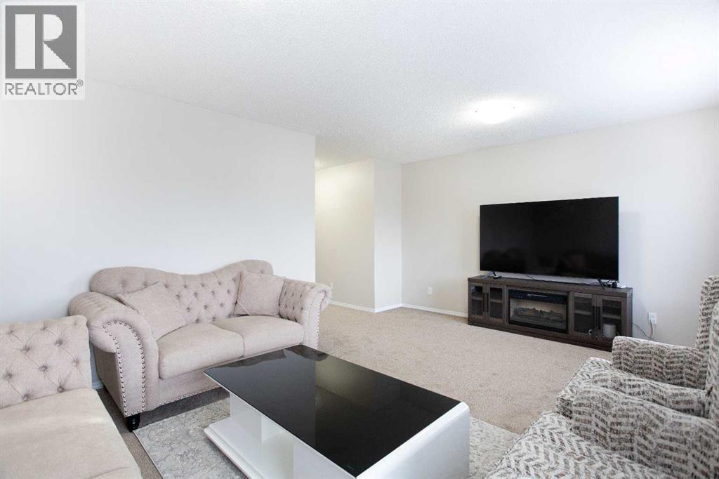 138 Saddlecrest Way Ne, Calgary, AB - Indoor Photo Showing Living Room