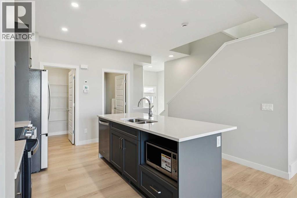 438 South Shore Drive, Chestermere, AB - Indoor Photo Showing Kitchen With Double Sink