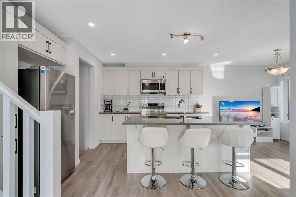 4 Southwinds Gate Sw, Airdrie, AB - Indoor Photo Showing Kitchen With Stainless Steel Kitchen With Upgraded Kitchen