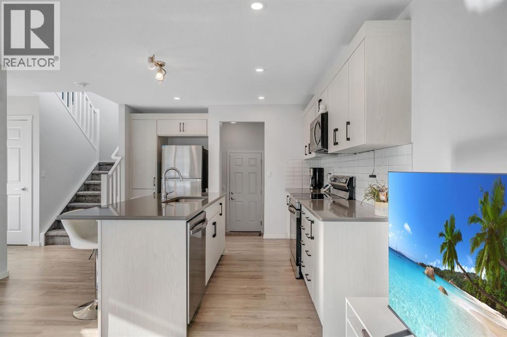 4 Southwinds Gate Sw, Airdrie, AB - Indoor Photo Showing Kitchen With Stainless Steel Kitchen With Upgraded Kitchen