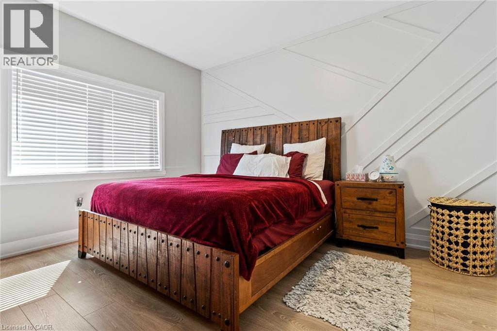 Bedroom featuring wood finished floors - 24 Tamarack Way, Simcoe, ON - Indoor Photo Showing Bedroom