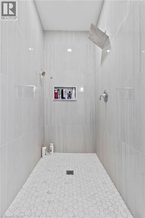Full bathroom featuring tiled shower - 24 Tamarack Way, Simcoe, ON - Indoor