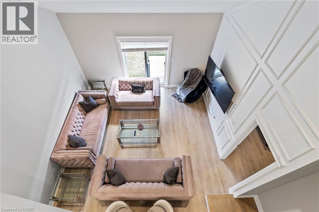Living room featuring light wood-style flooring - 24 Tamarack Way, Simcoe, ON - Indoor