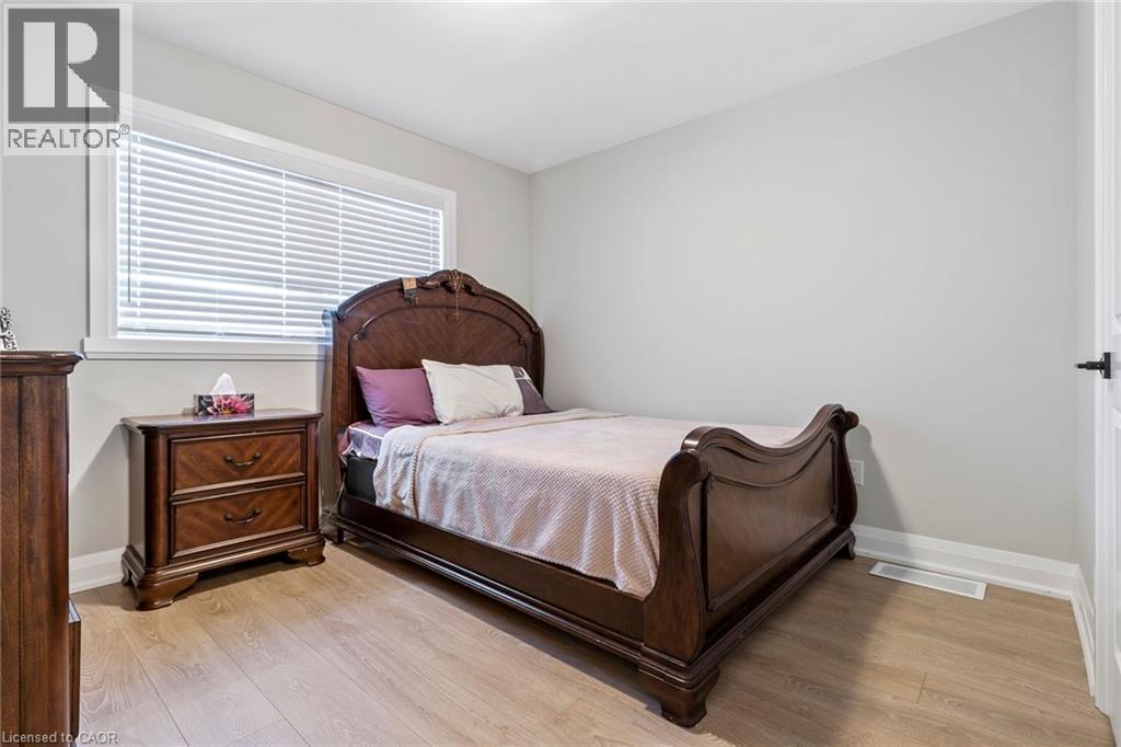 Bedroom featuring light wood-style floors - 24 Tamarack Way, Simcoe, ON - Indoor Photo Showing Bedroom
