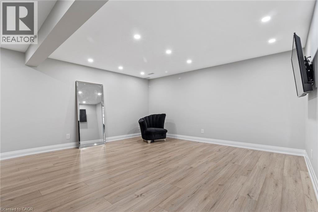 Unfurnished room featuring recessed lighting and light wood finished floors - 24 Tamarack Way, Simcoe, ON - Indoor Photo Showing Other Room