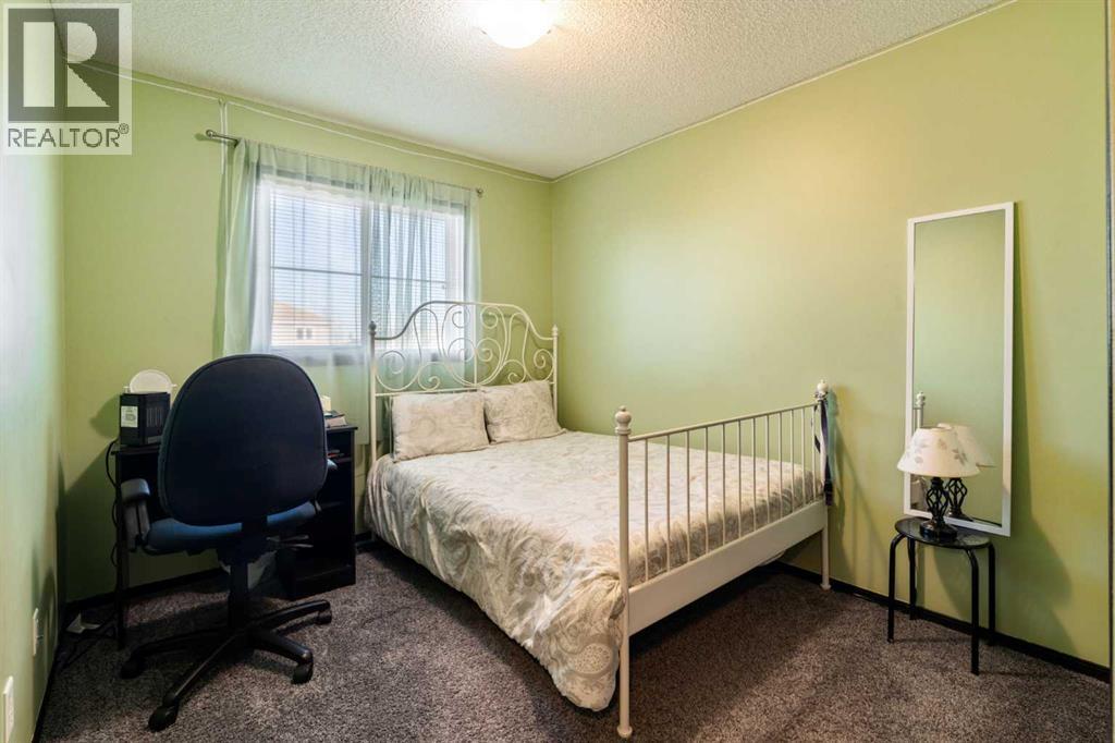 110 Eversyde Common Sw, Calgary, AB - Indoor Photo Showing Bedroom