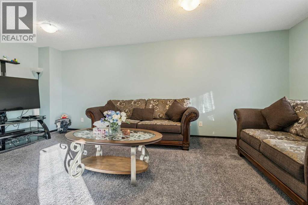 110 Eversyde Common Sw, Calgary, AB - Indoor Photo Showing Living Room