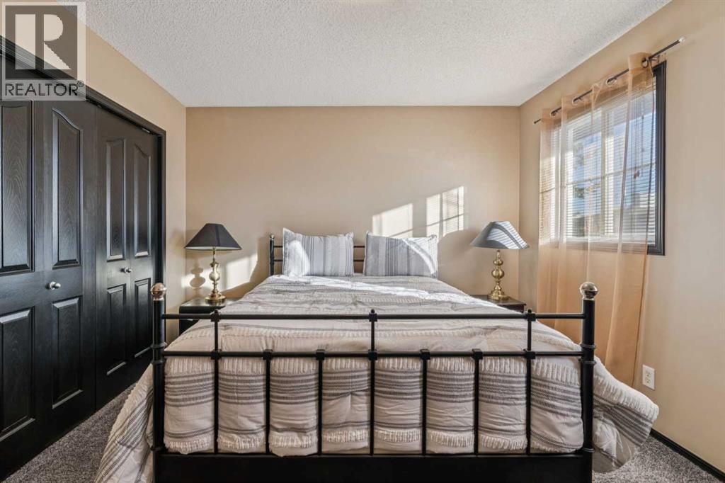 110 Eversyde Common Sw, Calgary, AB - Indoor Photo Showing Bedroom