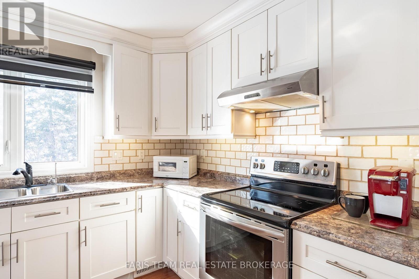 360 Concession Road 6 E, Tiny, ON - Indoor Photo Showing Kitchen With Double Sink