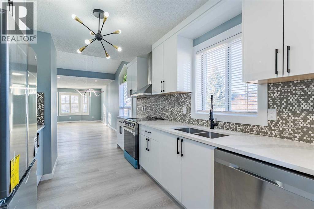134 Erin Meadow Crescent Se, Calgary, AB - Indoor Photo Showing Kitchen With Double Sink With Upgraded Kitchen