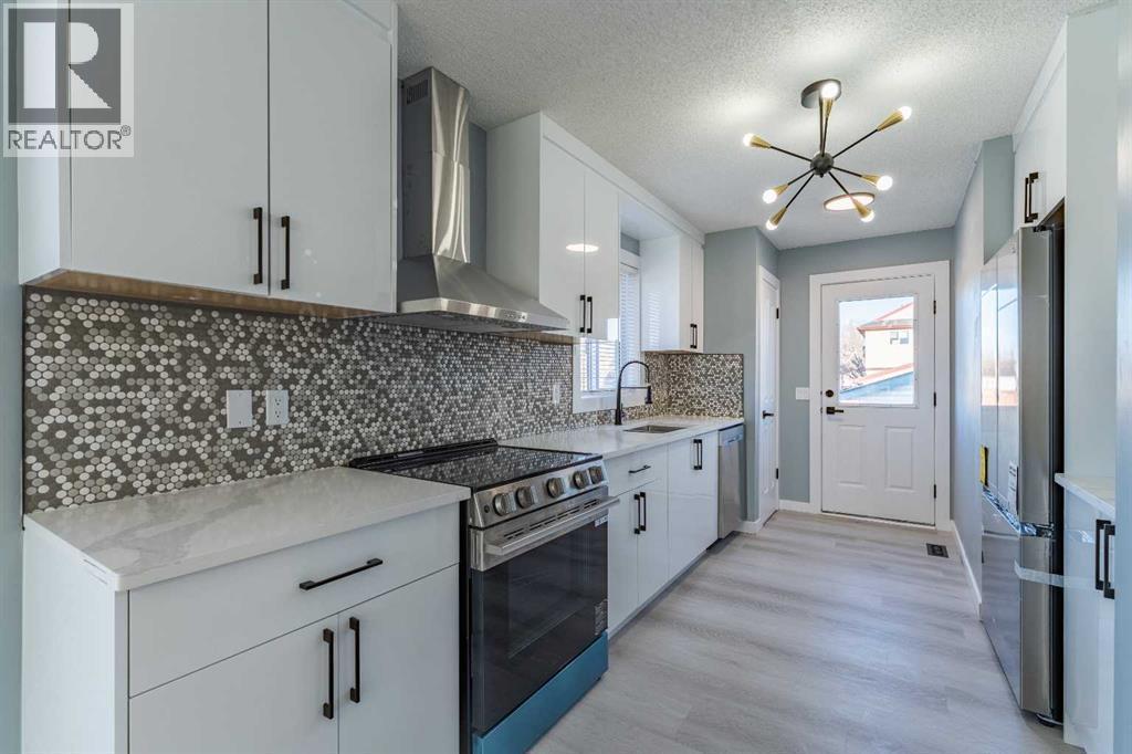 134 Erin Meadow Crescent Se, Calgary, AB - Indoor Photo Showing Kitchen With Upgraded Kitchen