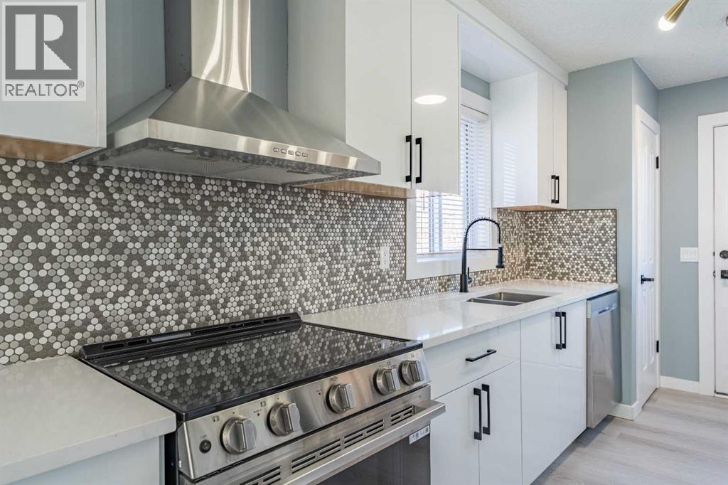 134 Erin Meadow Crescent Se, Calgary, AB - Indoor Photo Showing Kitchen With Double Sink With Upgraded Kitchen