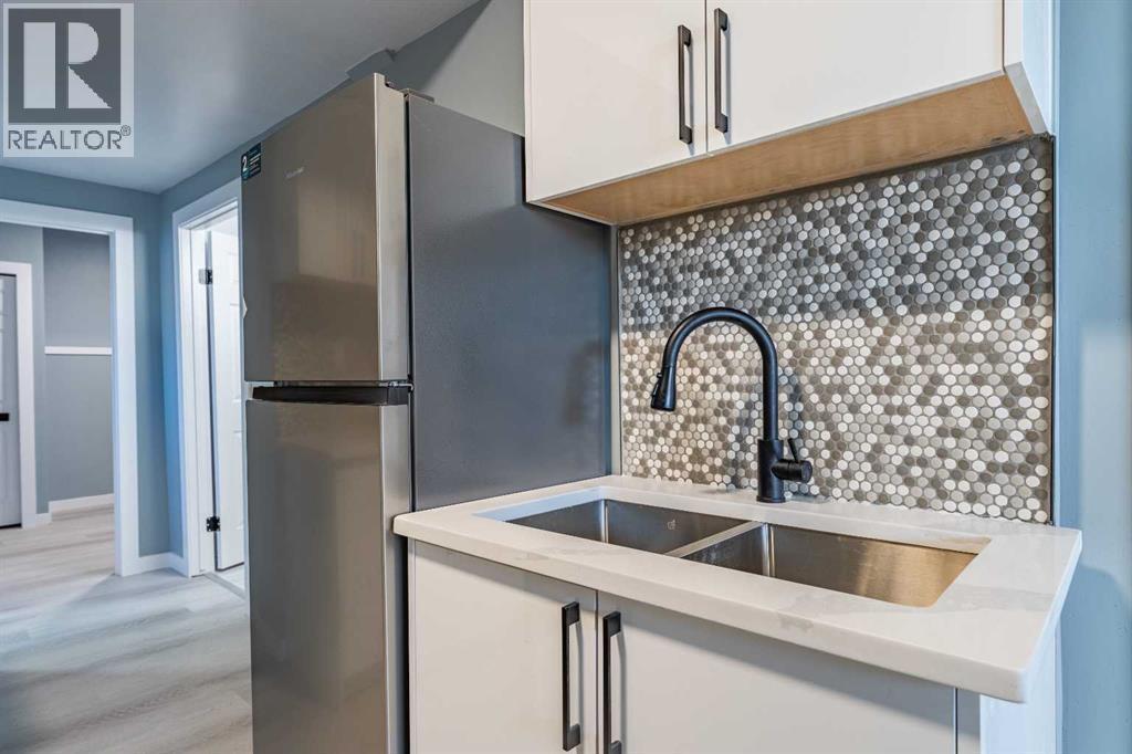 134 Erin Meadow Crescent Se, Calgary, AB - Indoor Photo Showing Kitchen With Double Sink
