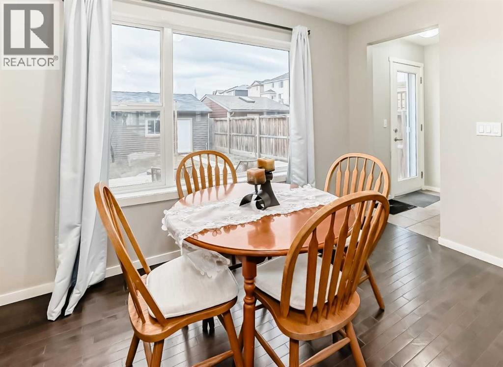 dinning area - 822 Panatella Boulevard Nw, Calgary, AB - Indoor Photo Showing Dining Room