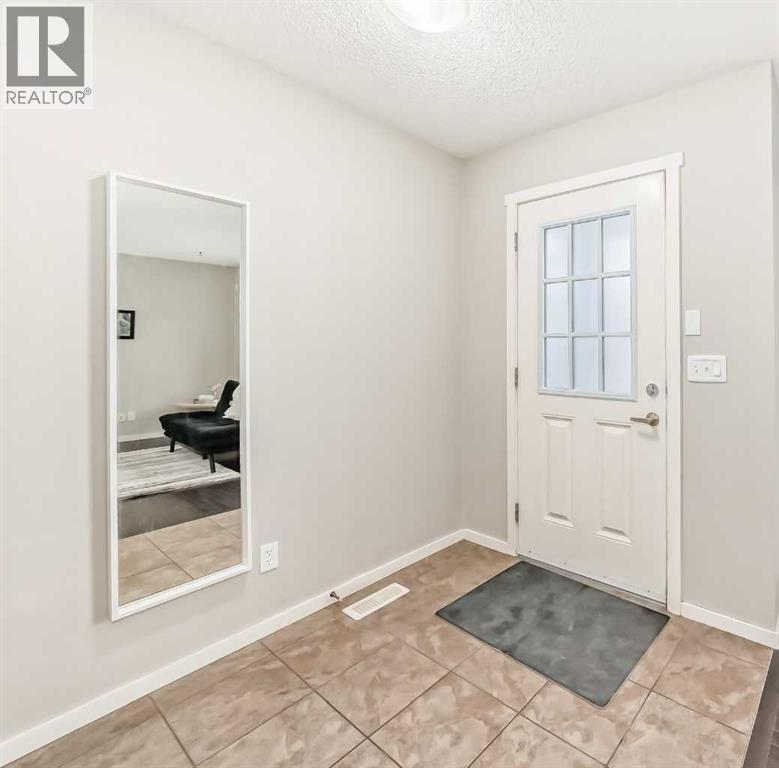 Front entrance area - 822 Panatella Boulevard Nw, Calgary, AB - Indoor Photo Showing Other Room