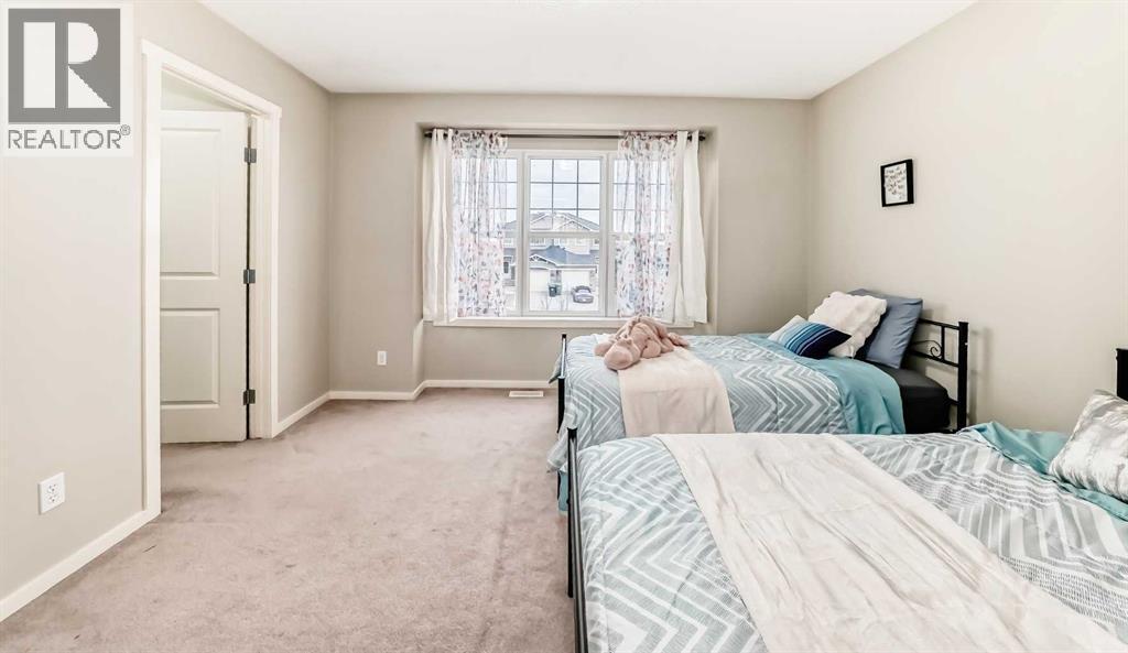 822 Panatella Boulevard Nw, Calgary, AB - Indoor Photo Showing Bedroom