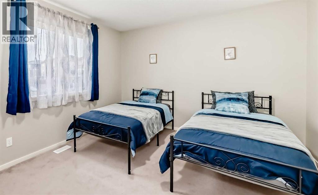 second master bedroom - 822 Panatella Boulevard Nw, Calgary, AB - Indoor Photo Showing Bedroom