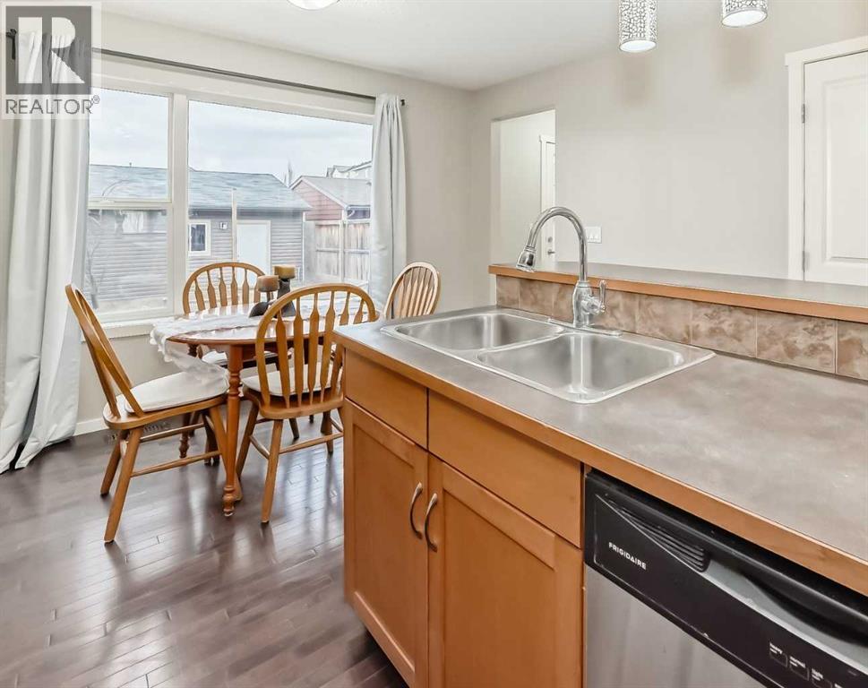 822 Panatella Boulevard Nw, Calgary, AB - Indoor Photo Showing Kitchen With Double Sink