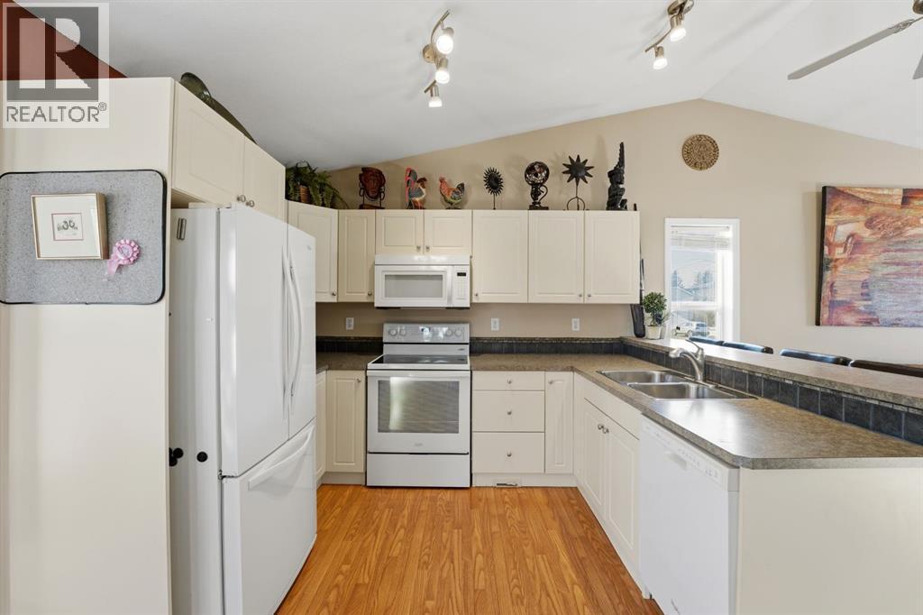 57 Garden Road, Lacombe, AB - Indoor Photo Showing Kitchen With Double Sink