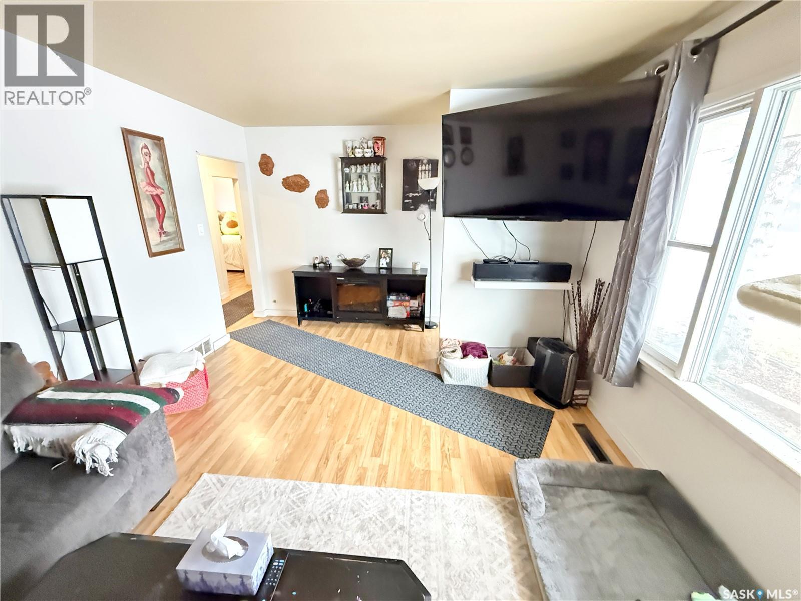 223 4Th Street, Weyburn, SK - Indoor Photo Showing Other Room With Fireplace