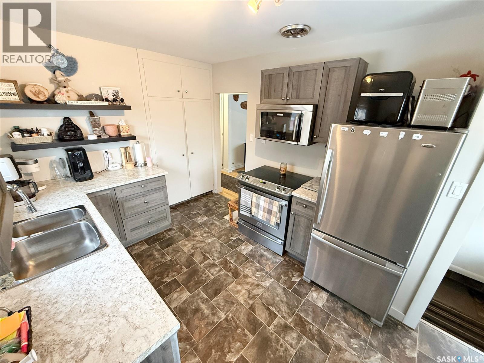 223 4Th Street, Weyburn, SK - Indoor Photo Showing Kitchen With Stainless Steel Kitchen