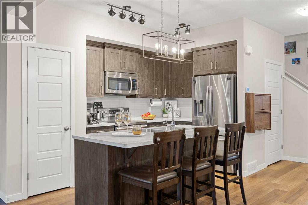 1027 Lanark Boulevard Se, Airdrie, AB - Indoor Photo Showing Kitchen With Stainless Steel Kitchen With Upgraded Kitchen
