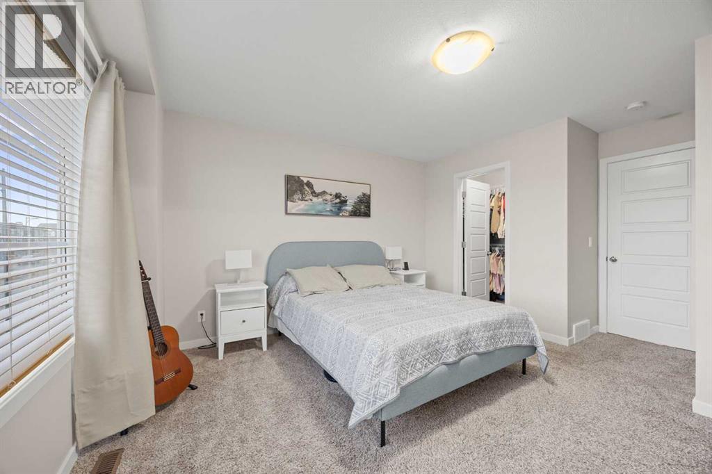 1027 Lanark Boulevard Se, Airdrie, AB - Indoor Photo Showing Bedroom