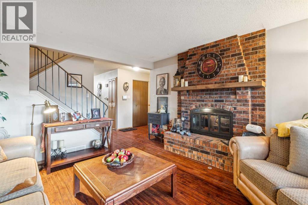 119 Whiteridge Place Ne, Calgary, AB - Indoor Photo Showing Living Room With Fireplace