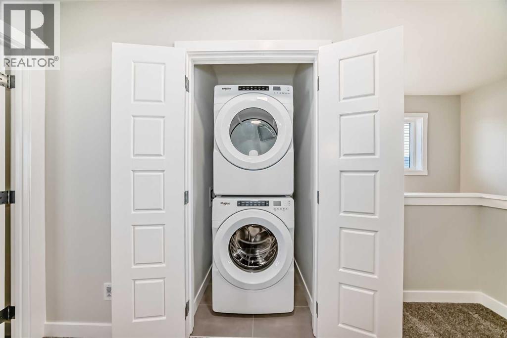 241 Bridgeport Gate, Chestermere, AB - Indoor Photo Showing Laundry Room