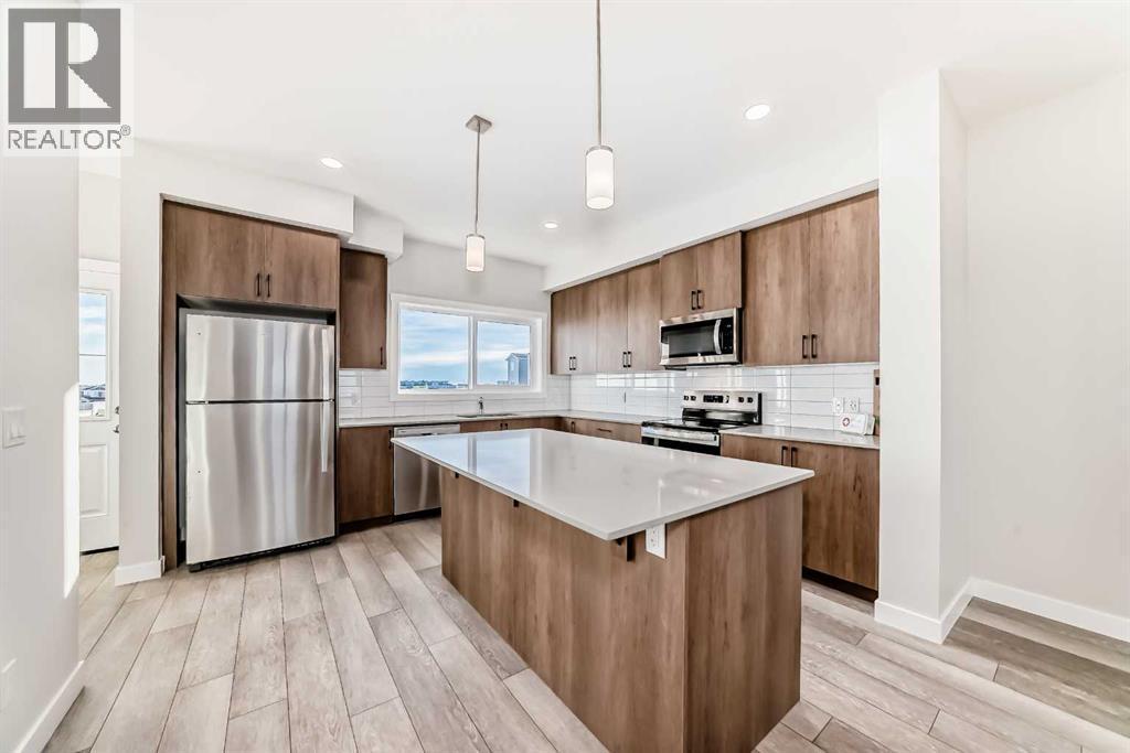 241 Bridgeport Gate, Chestermere, AB - Indoor Photo Showing Kitchen With Upgraded Kitchen