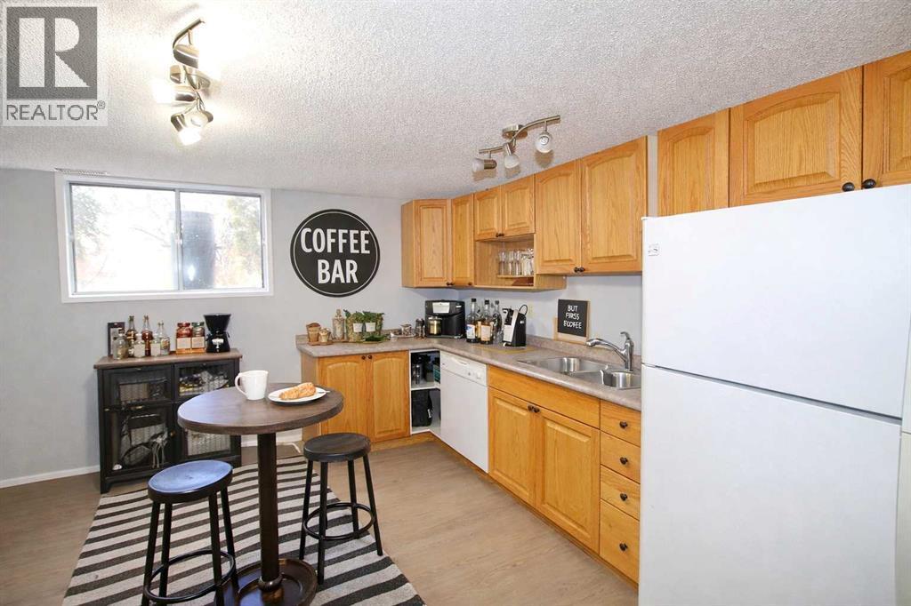 virtually staged - 97 Cunningham Crescent, Red Deer, AB - Indoor Photo Showing Kitchen With Double Sink