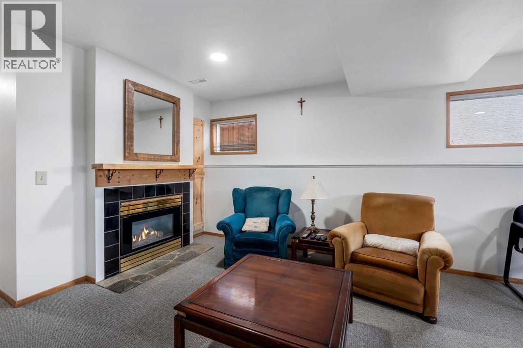 192 Rivercrest Close Se, Calgary, AB - Indoor Photo Showing Living Room With Fireplace