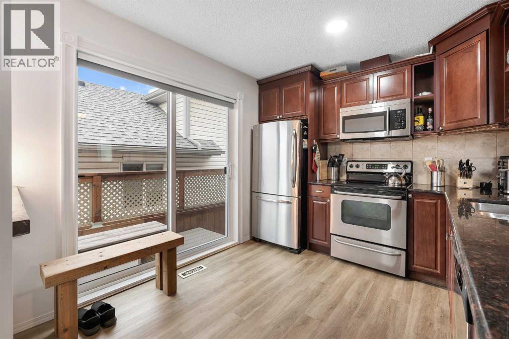 192 Rivercrest Close Se, Calgary, AB - Indoor Photo Showing Kitchen With Double Sink
