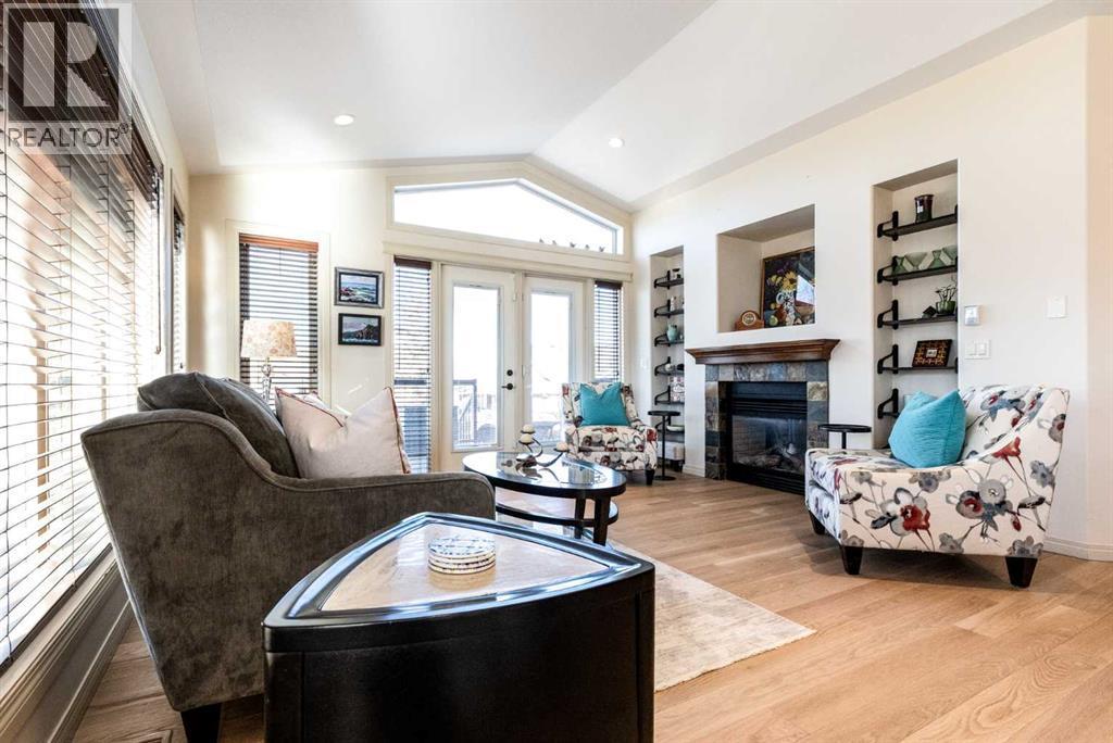 6371 Cedar Way, Innisfail, AB - Indoor Photo Showing Living Room With Fireplace