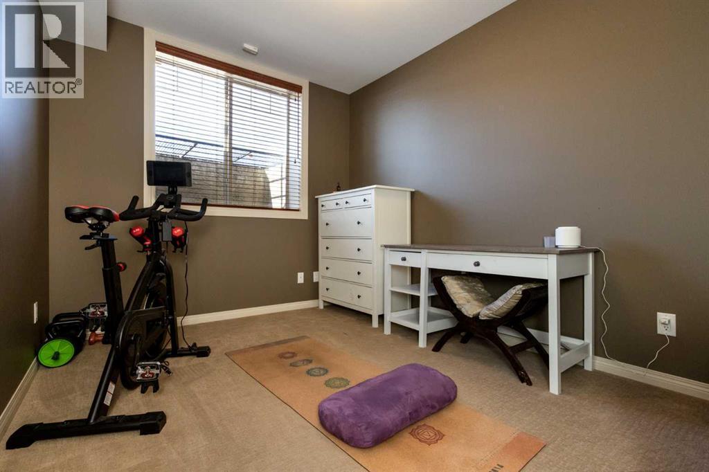 6371 Cedar Way, Innisfail, AB - Indoor Photo Showing Gym Room