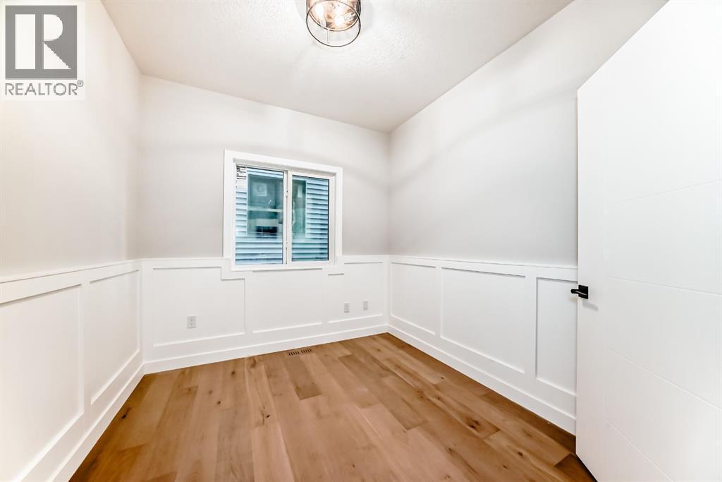 Main floor office with feature walls - 508 Heritage Boulevard, Cochrane, AB - Indoor Photo Showing Other Room