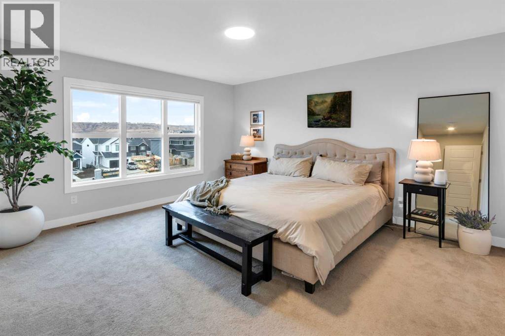 287 Rivercrest Boulevard, Cochrane, AB - Indoor Photo Showing Bedroom