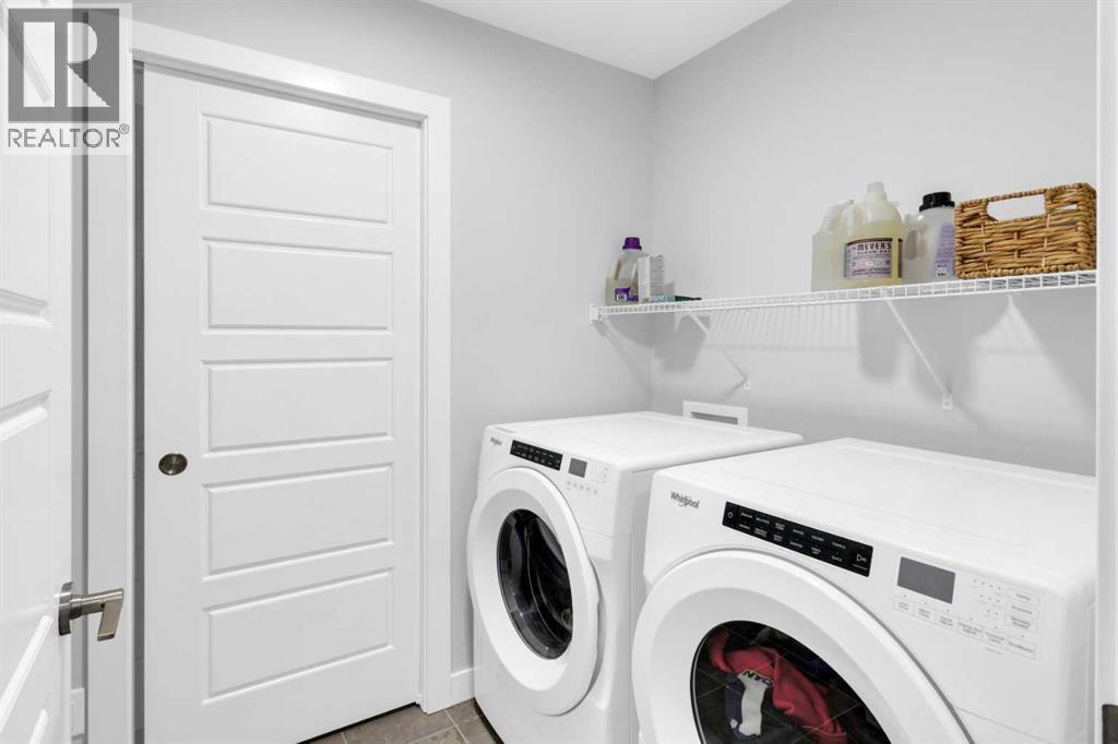 287 Rivercrest Boulevard, Cochrane, AB - Indoor Photo Showing Laundry Room