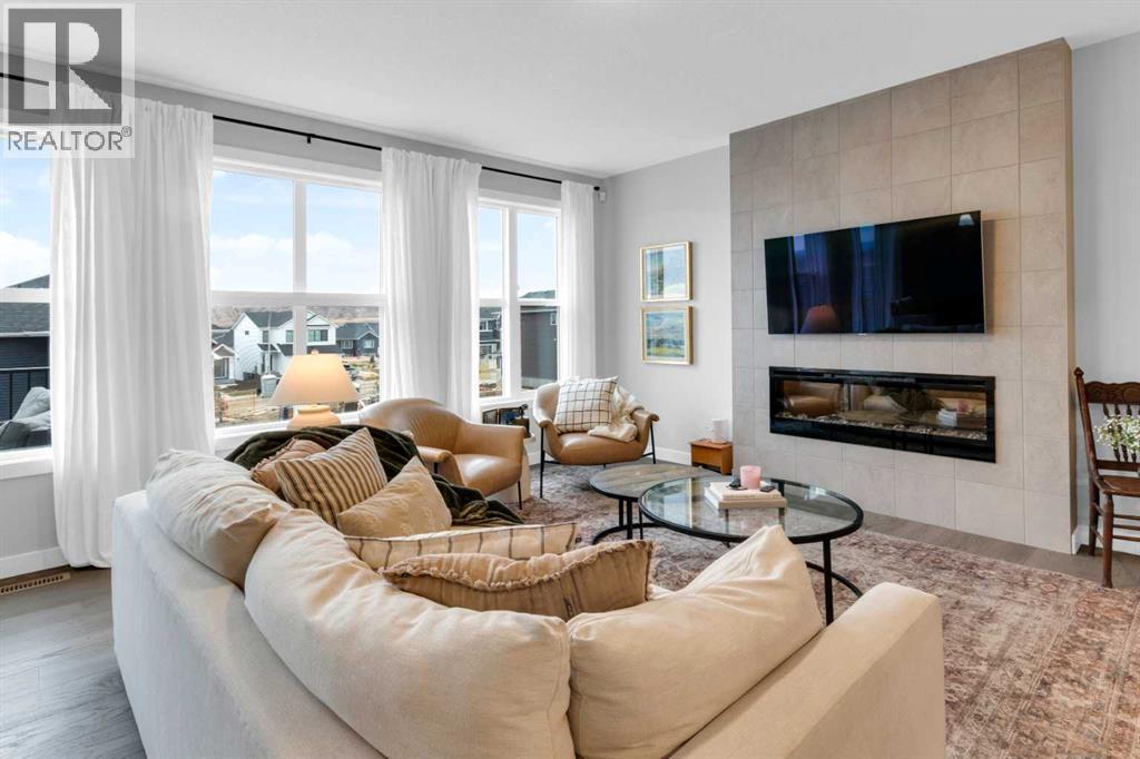 287 Rivercrest Boulevard, Cochrane, AB - Indoor Photo Showing Living Room With Fireplace