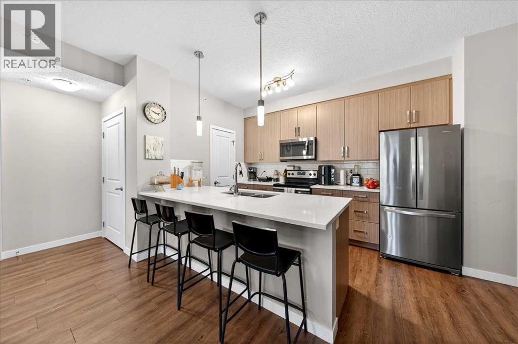 302, 200 Cranfield Common Se, Calgary, AB - Indoor Photo Showing Kitchen With Upgraded Kitchen