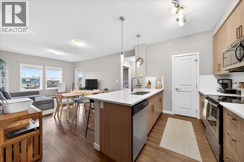 302, 200 Cranfield Common Se, Calgary, AB - Indoor Photo Showing Kitchen With Upgraded Kitchen