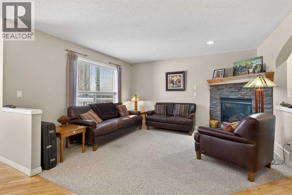 Living Room - 627 Auburn Bay Heights Se, Calgary, AB - Indoor Photo Showing Living Room With Fireplace