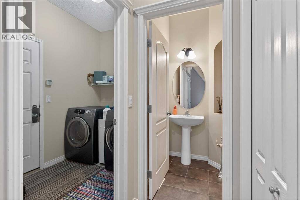 2 Piece Bath Main - 627 Auburn Bay Heights Se, Calgary, AB - Indoor Photo Showing Laundry Room