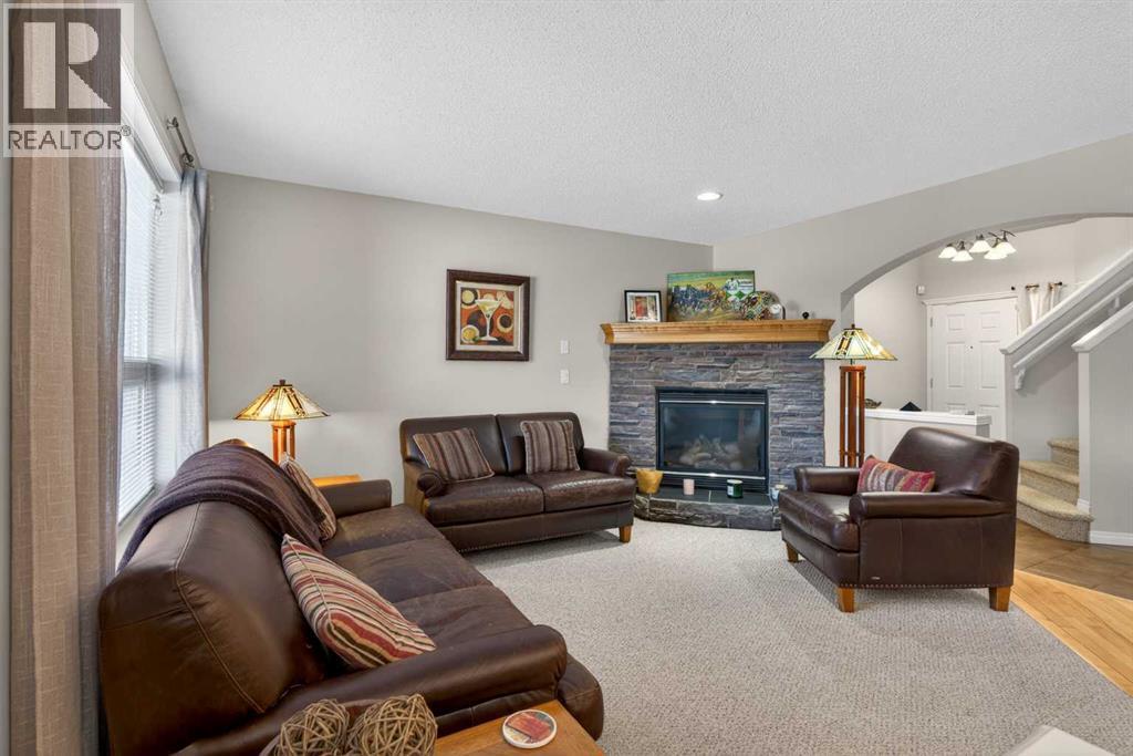 Living Room - 627 Auburn Bay Heights Se, Calgary, AB - Indoor Photo Showing Living Room With Fireplace