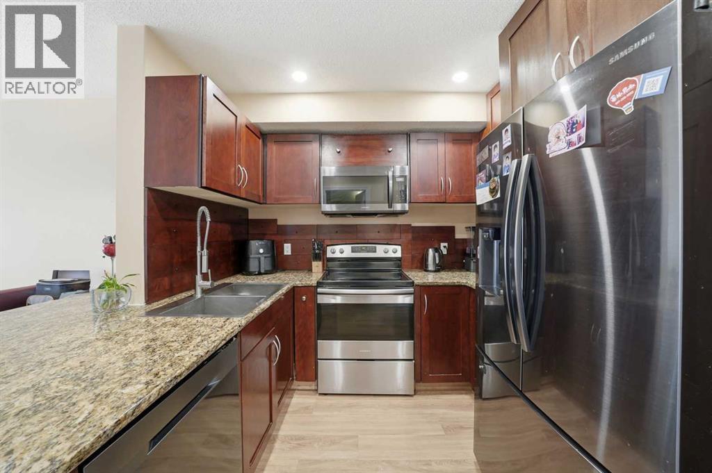 80 Taradale Drive S, Calgary, AB - Indoor Photo Showing Kitchen With Double Sink