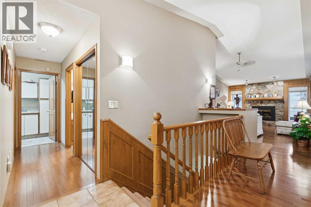 1025 Shawnee Road Sw, Calgary, AB - Indoor Photo Showing Other Room With Fireplace