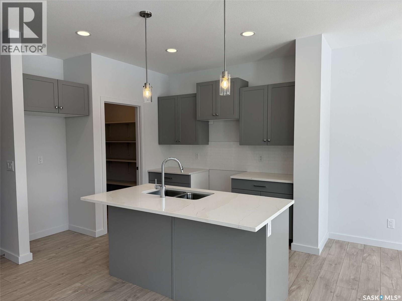 319 Cowessess Road, Saskatoon, SK - Indoor Photo Showing Kitchen With Double Sink With Upgraded Kitchen